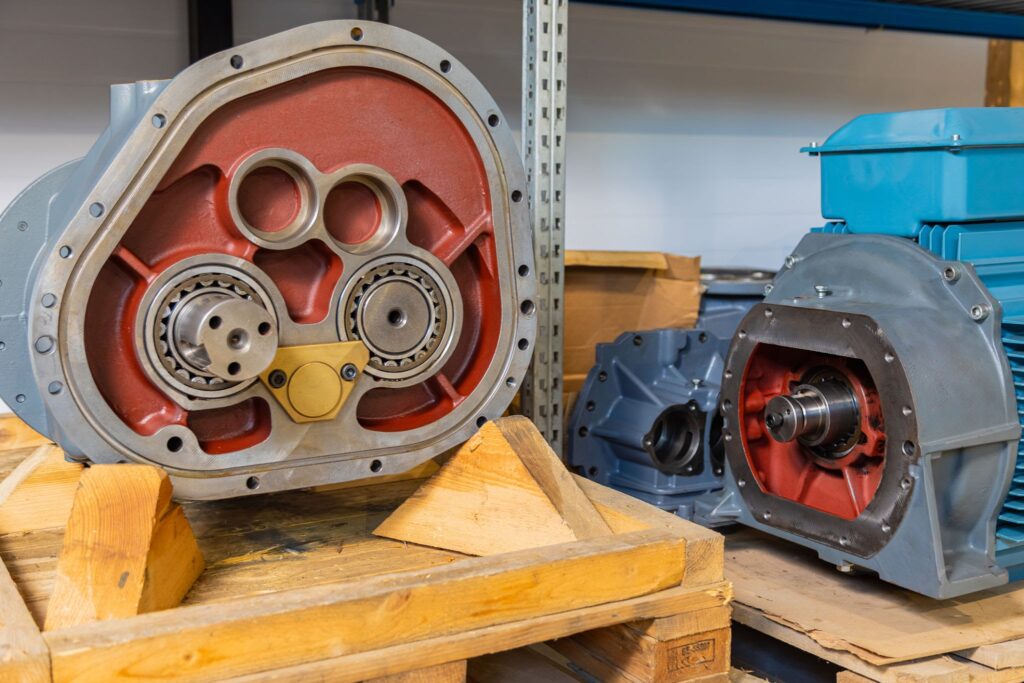 Close up of gearbox housing revealing intricate gears and bearings, showcasing industrial mechanics and engineering